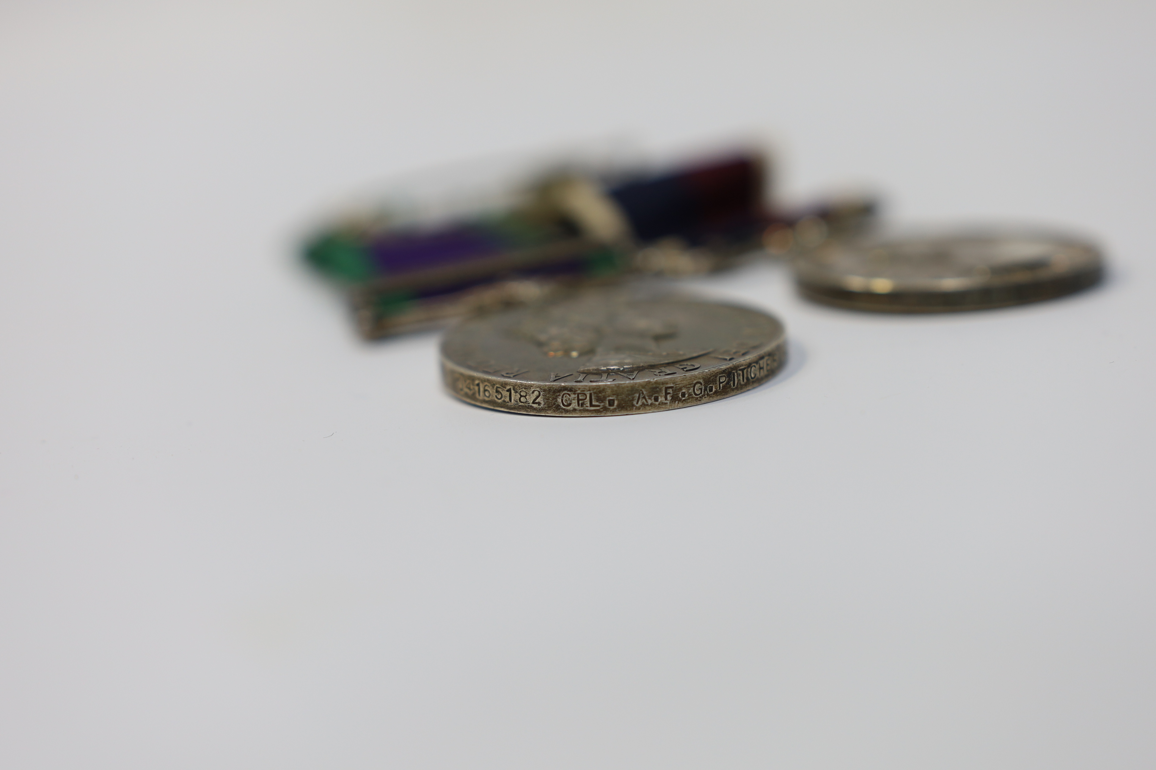 An ERII RAF medal pair awarded to Cpl. A.F.G. Pitcher RAF, comprising; a General Service Medal with a bar for Borneo and an RAF Long Service Medal, mounted on a common pin. Condition - fair to good